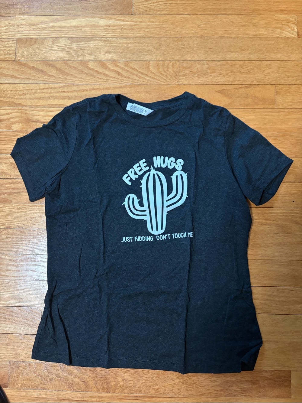 Black Graphic Tee with Mint Cactus Print - Free Hugs